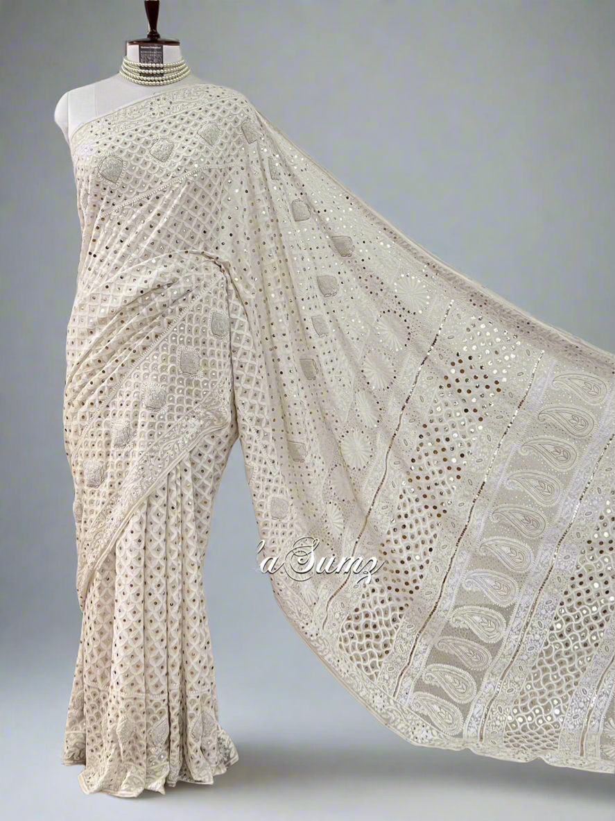 Full picture Lily white saree featuring Chikankari, Mukaish work, and pearls