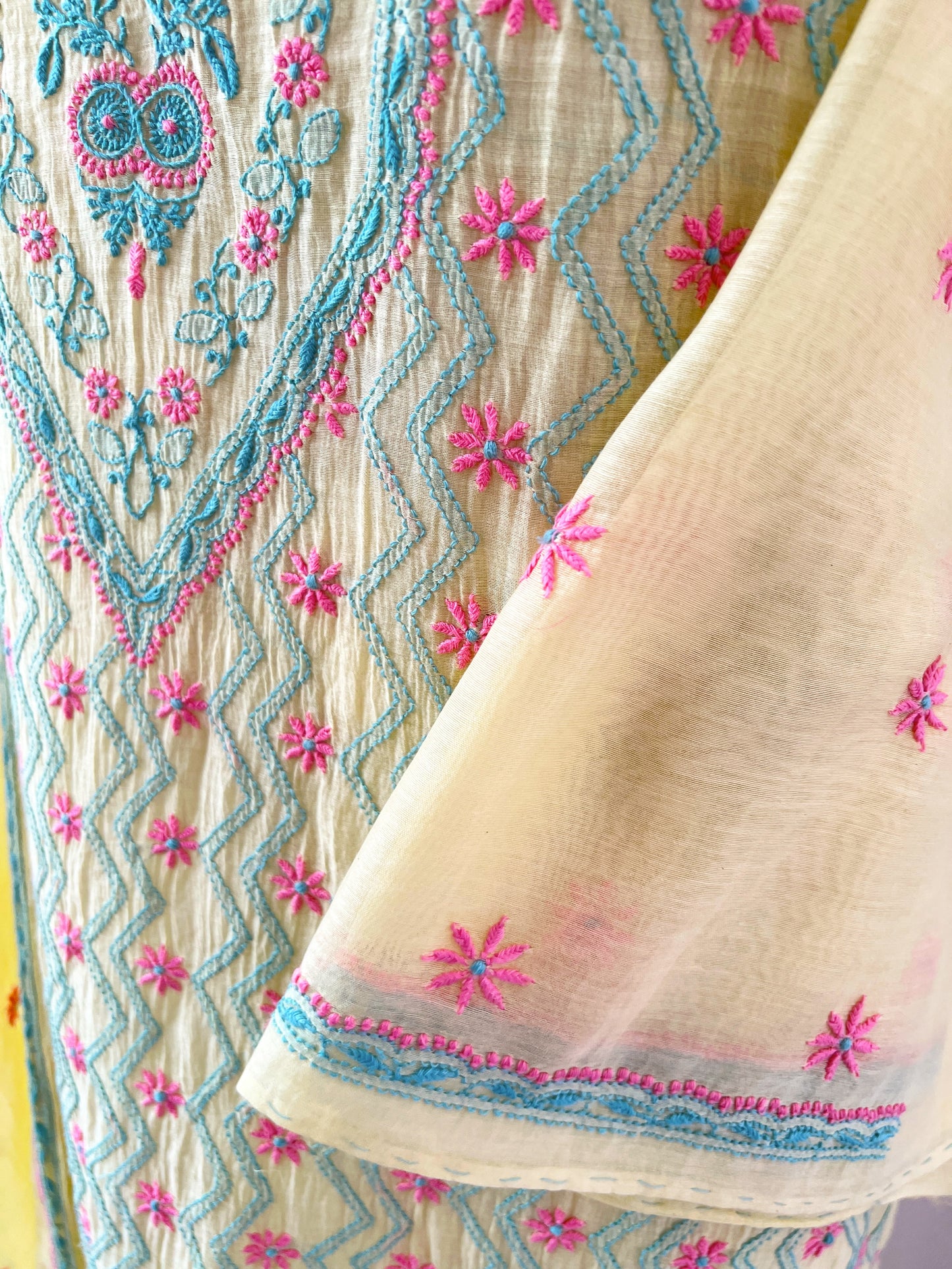 Lemon yellow Chikankari suit featuring intricate multicolour embroidery