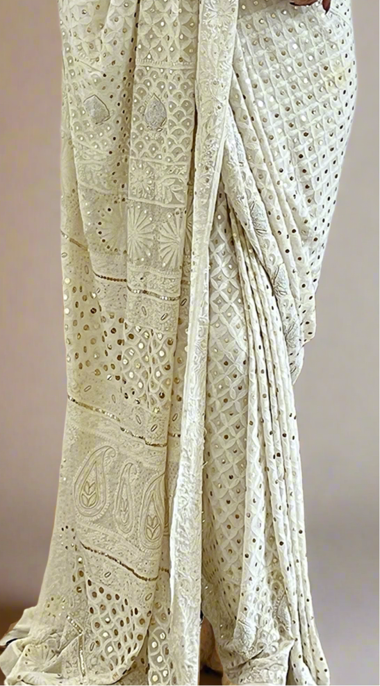 Lily white saree featuring Chikankari, Mukaish work, and pearls close up