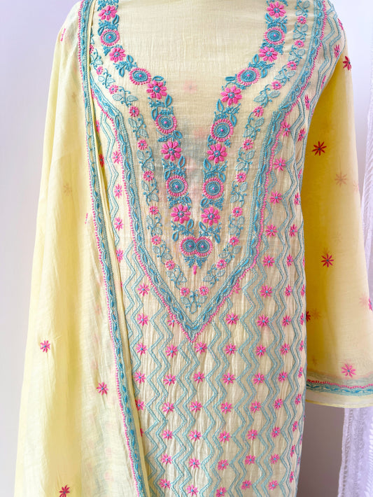 Lemon yellow Chikankari suit featuring intricate multicolour embroidery