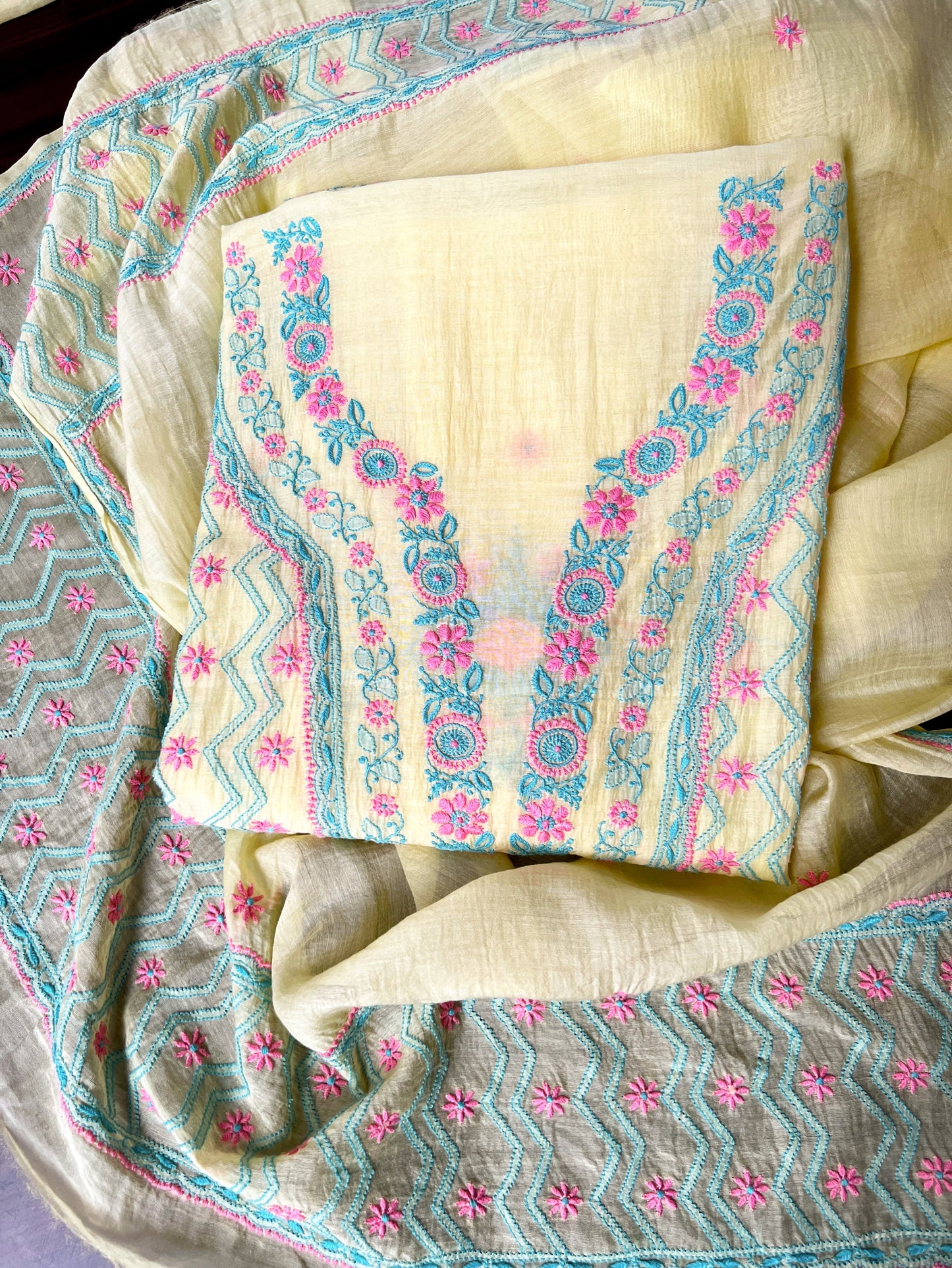 Lemon yellow Chikankari suit featuring intricate multicolour embroidery