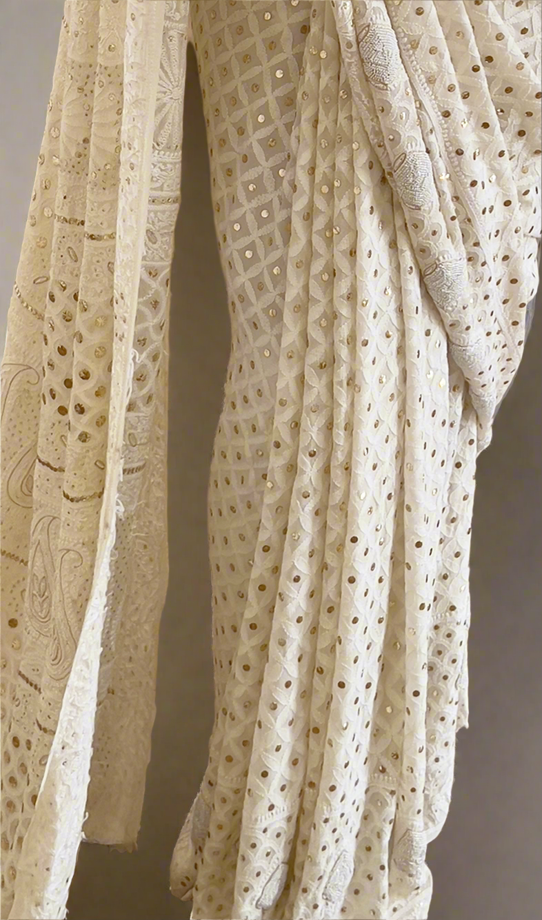 Lily White saree featuring intricate Chikankari embroidery, Mukaish accents, and elegant pearl details.