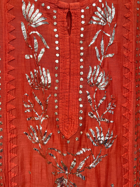 Rust Orange Mul Chanderi Suit with Mukaish hand-embroidered floral designs and silver embellishments.