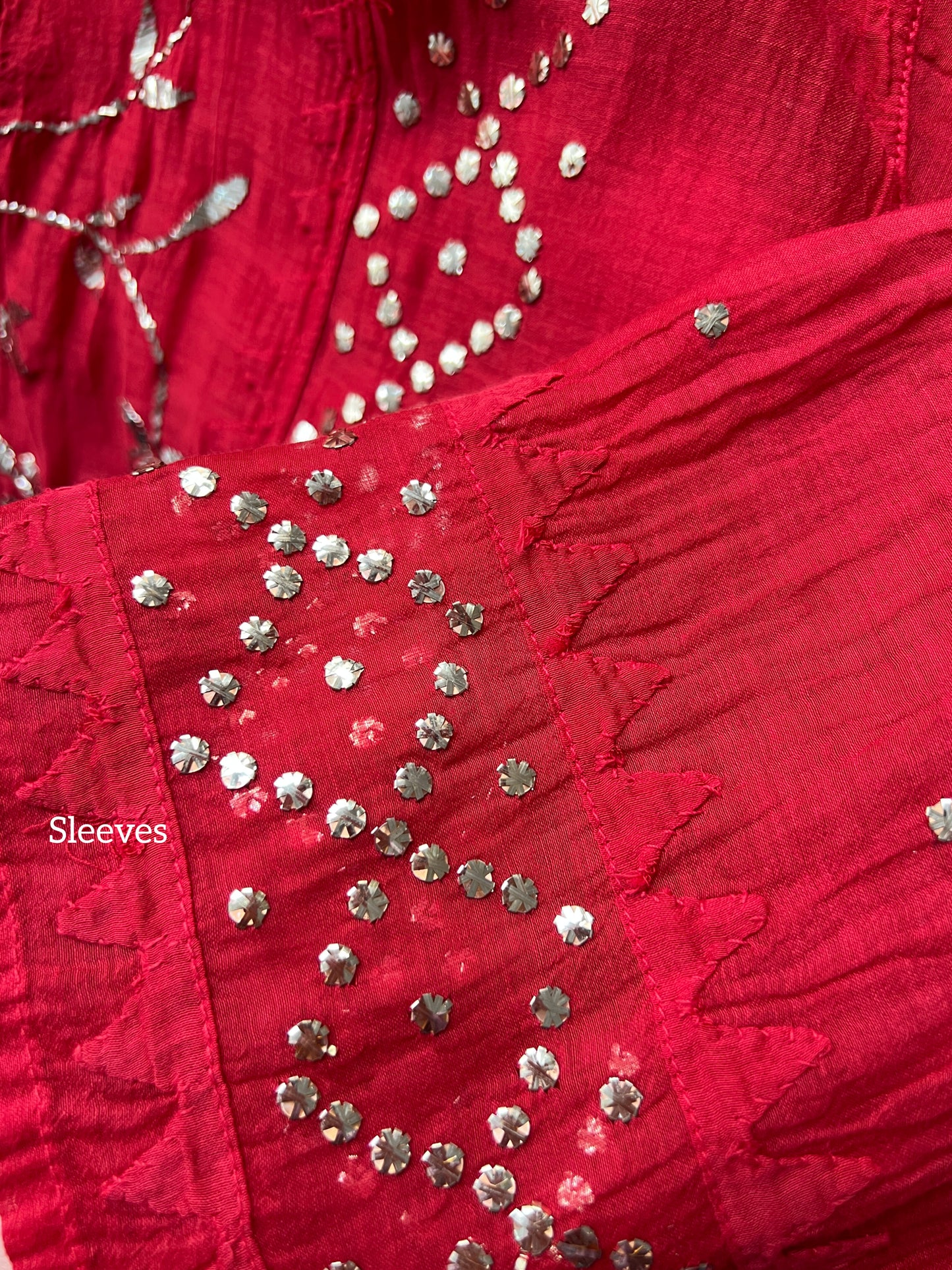 Detail of sleeves showcasing Mukaish embroidery on Red Mul Chanderi Suit with Mukaish.