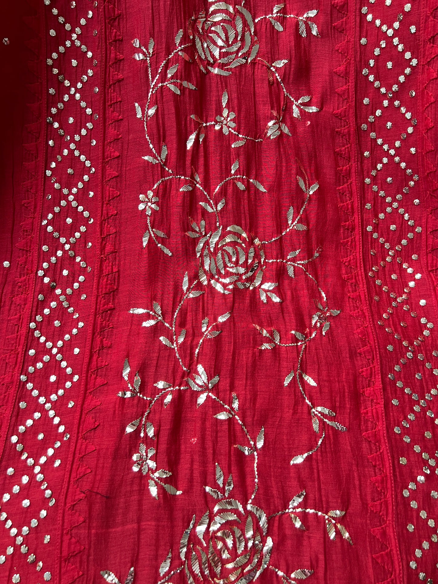 Red Mul Chanderi Suit with Mukaish showcasing intricate embroidery details on rich fabric.