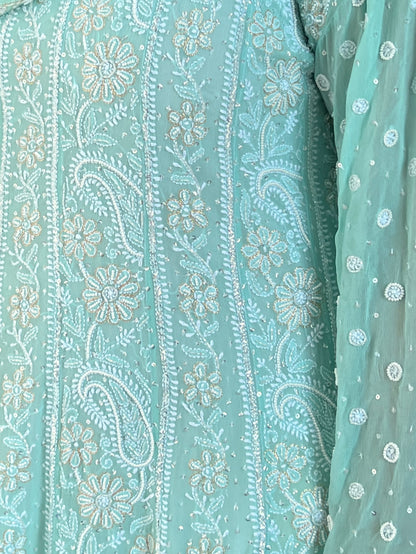 Mint green Anarkali featuring intricate Chikankari embroidery and embellishments on luxurious Georgette fabric.