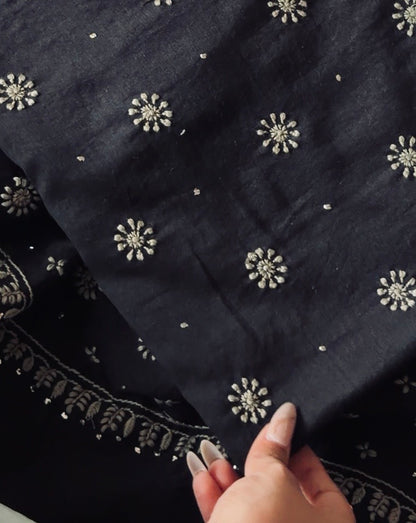 Black Chanderi suit with Chikankari detailed embroidery showcasing floral motifs and intricate Kamdani design.