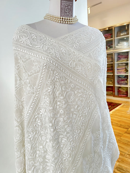 Elegant Pearl White Georgette Chikankari Saree with intricate hand embroidery and delicate Haath Jaali work.