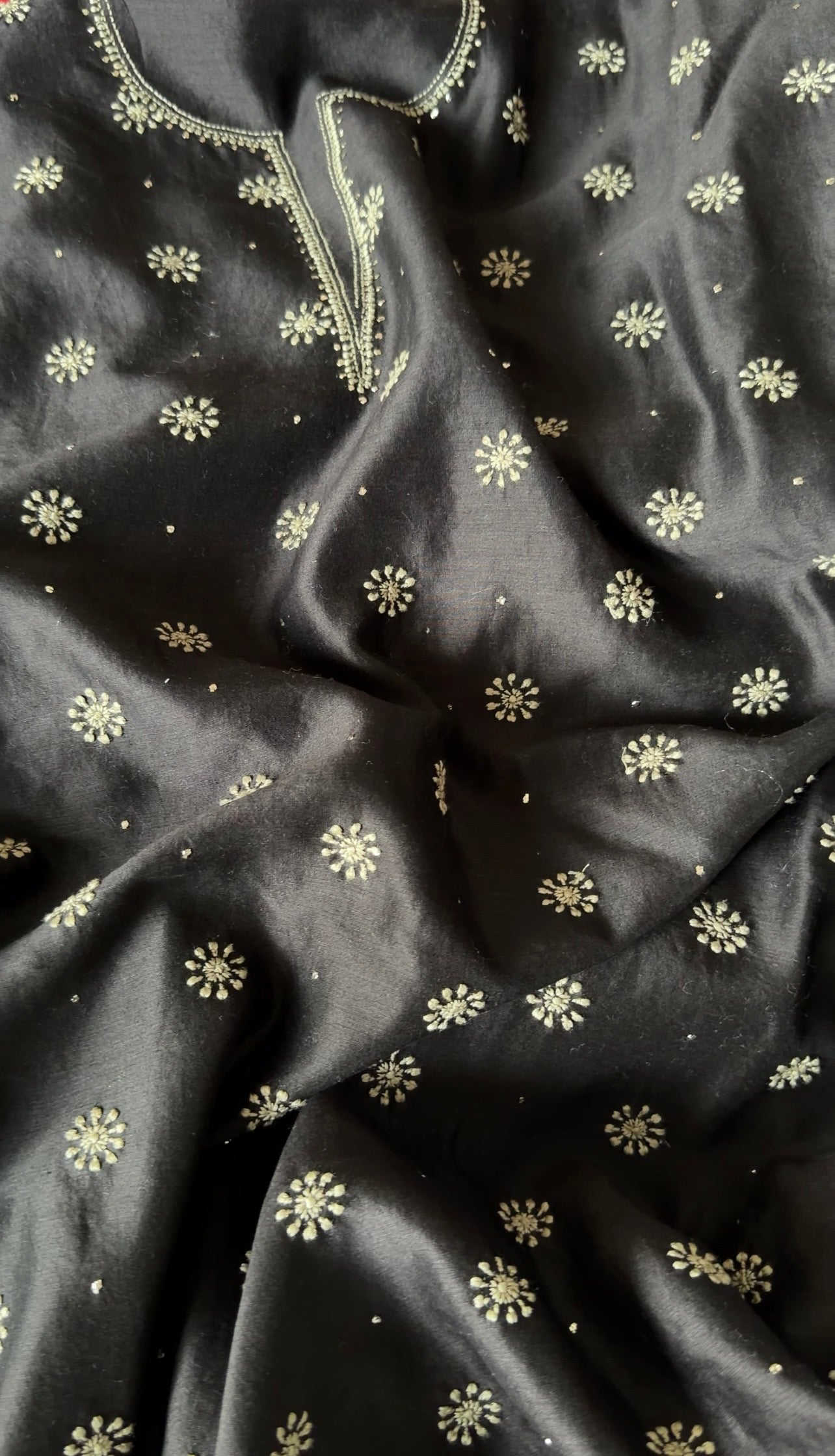 Black Chanderi suit with Chikankari featuring delicate floral embroidery and luxurious fabric texture.