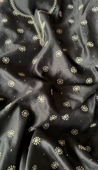 Black Chanderi suit with Chikankari featuring delicate floral embroidery and luxurious fabric texture.
