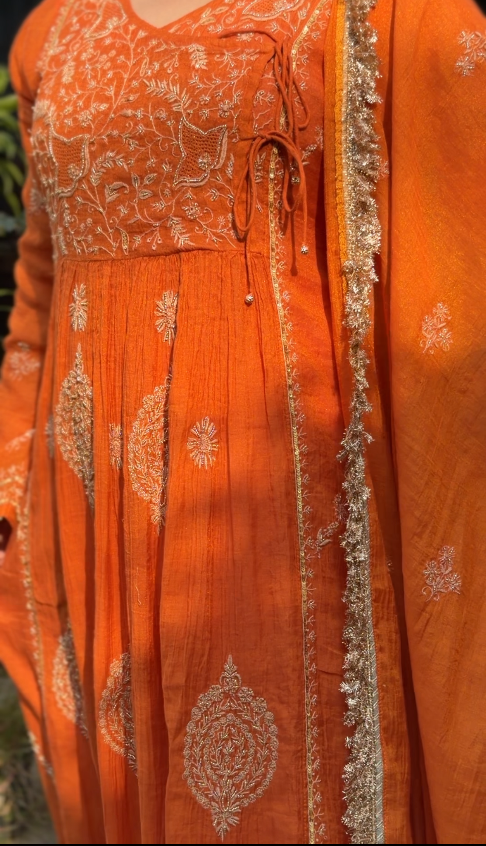Rust Orange Tissue Angarkha with Chikankari showcasing intricate embroidery and elegant design.
