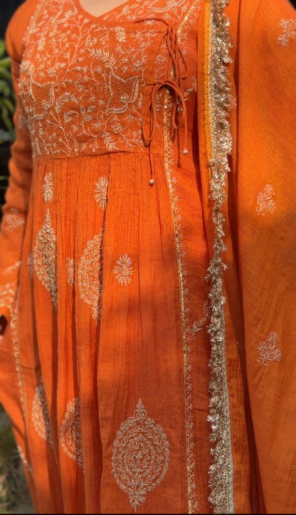 Rust Orange Tissue Angarkha with Chikankari showcasing intricate embroidery and elegant design.