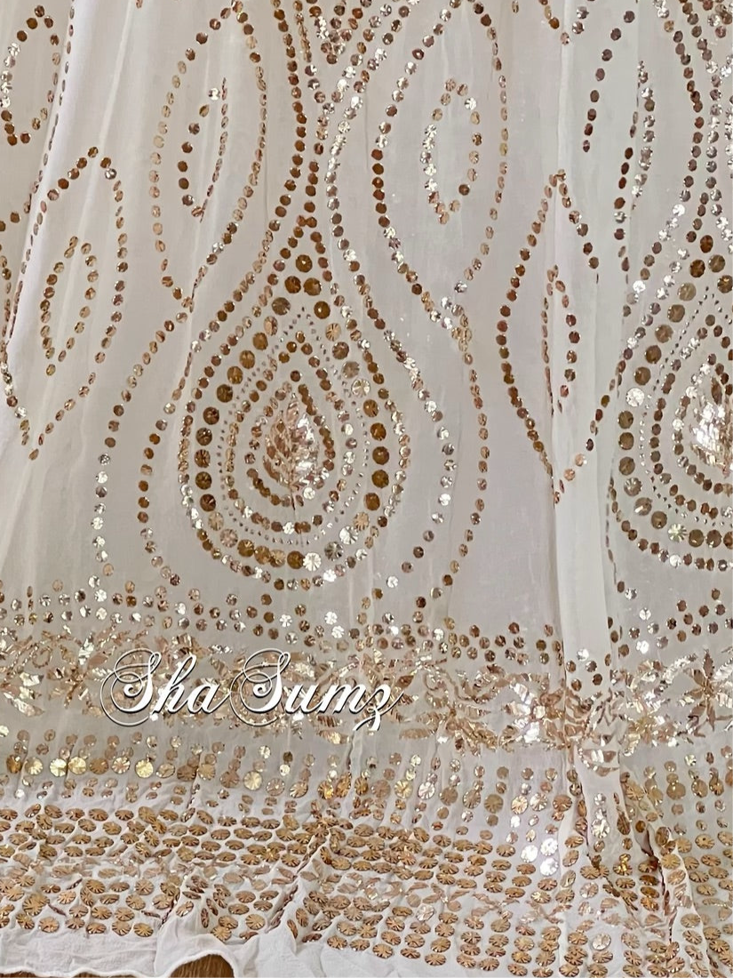 Close Up Elegant off white Mukaish lehanga with intricate embroidery and shimmering sequins on pure georgette fabric.