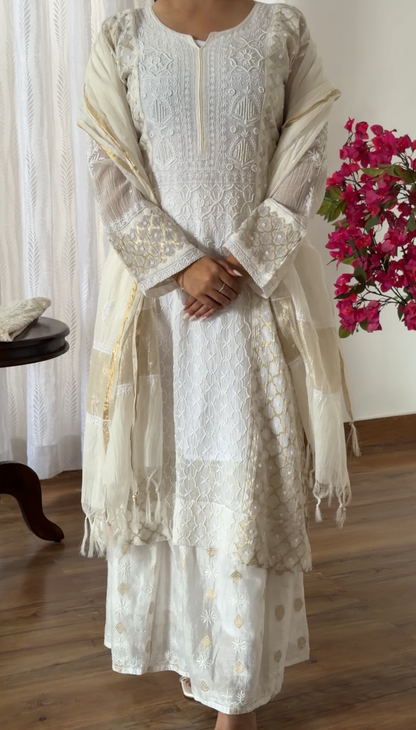 Mul Chanderi Chikankari kurta set displayed with elegant embroidery and Zari weave, perfect for festive occasions.