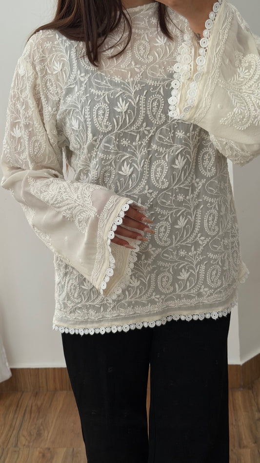 The Mehrab Shirt hand-embroidered fine chikankari on pure georgette, featuring intricate detailing and bell sleeves.