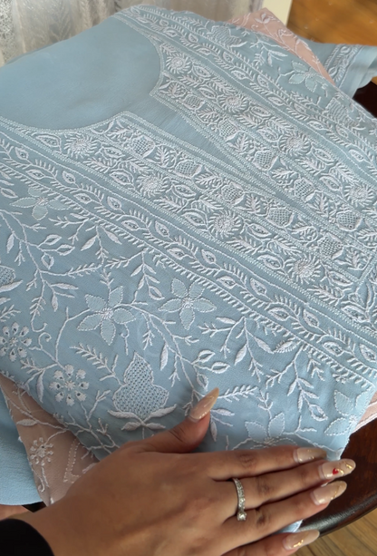 Powder blue pure georgette suit with do Taar chikankari, showcasing intricate embroidery and elegant design.