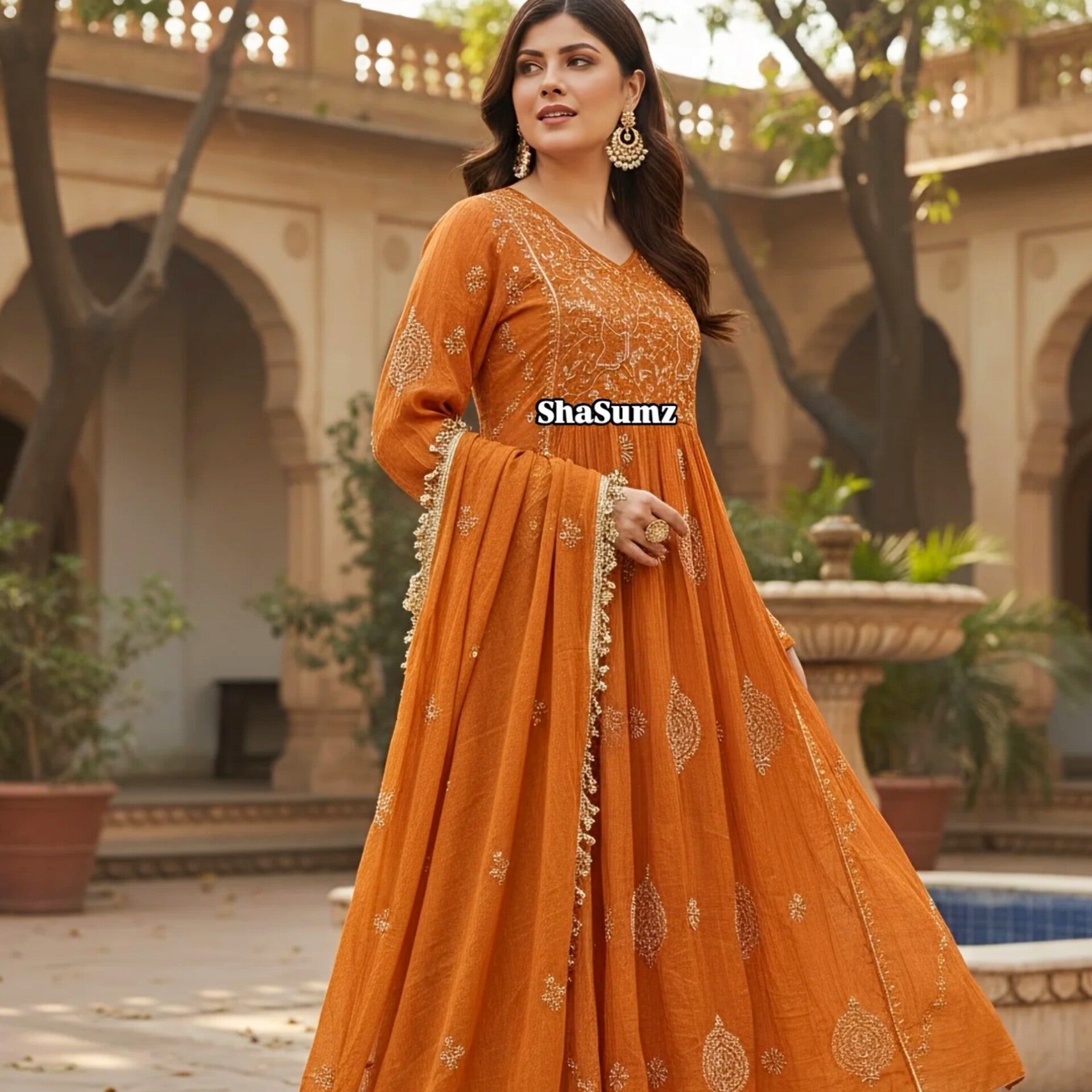 Rust Orange Tissue Angarkha with Chikankari worn by a model in an outdoor setting