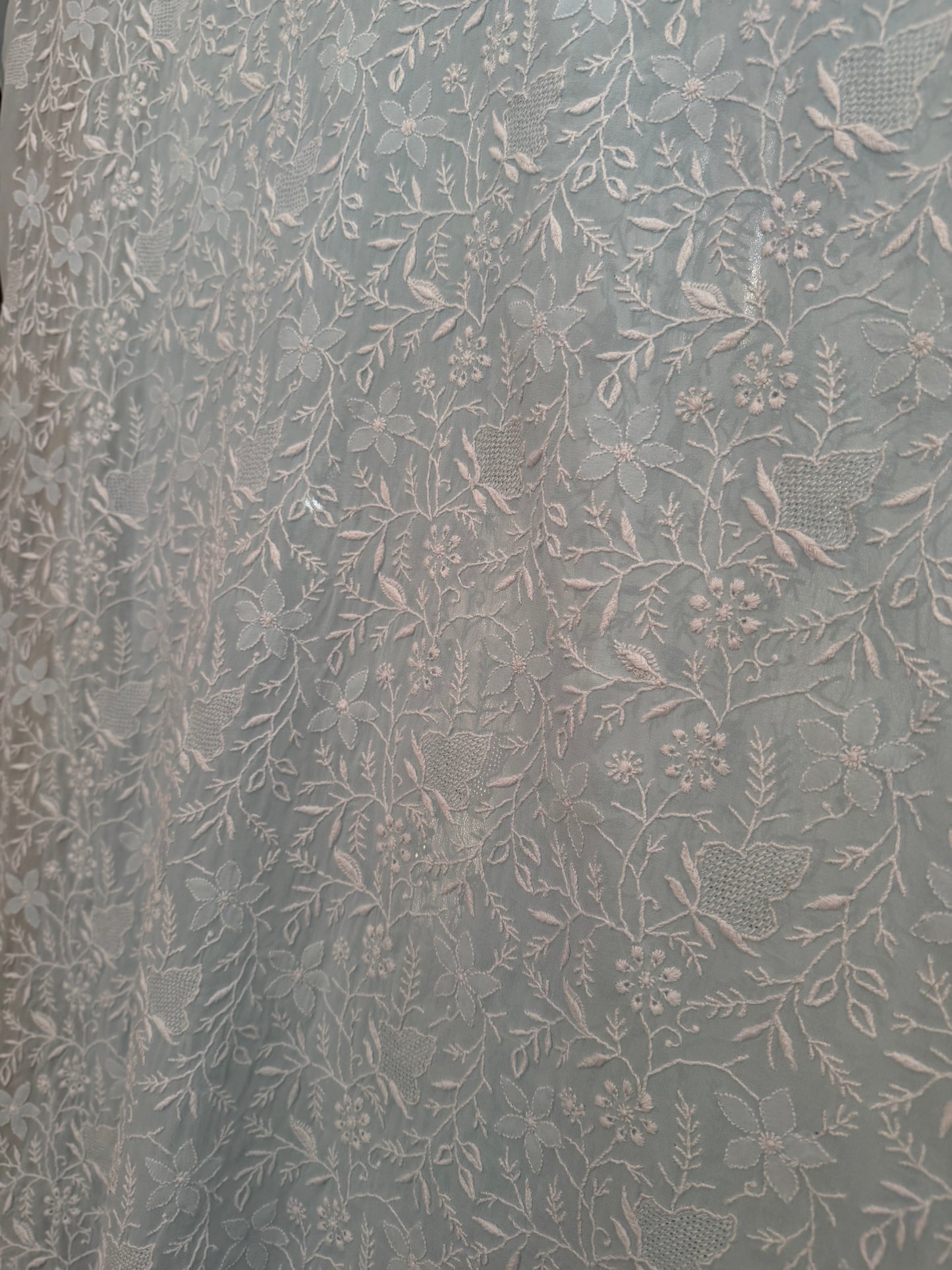 Detailed embroidery of the Powder Blue Pure Georgette Suit with Do Taar Chikankari & Haath Jaali.