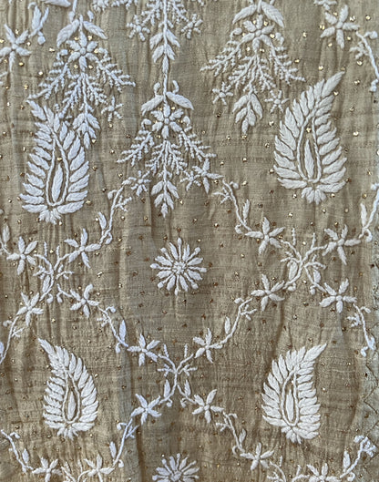 Detailed embroidery of Pure Tussar Silk showcasing Chikankari and Mukaish techniques.