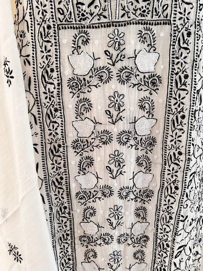 Monochrome Chikankari and Embellishments Kurta Set on Mul Chanderi with intricate detailing in natural light close up 