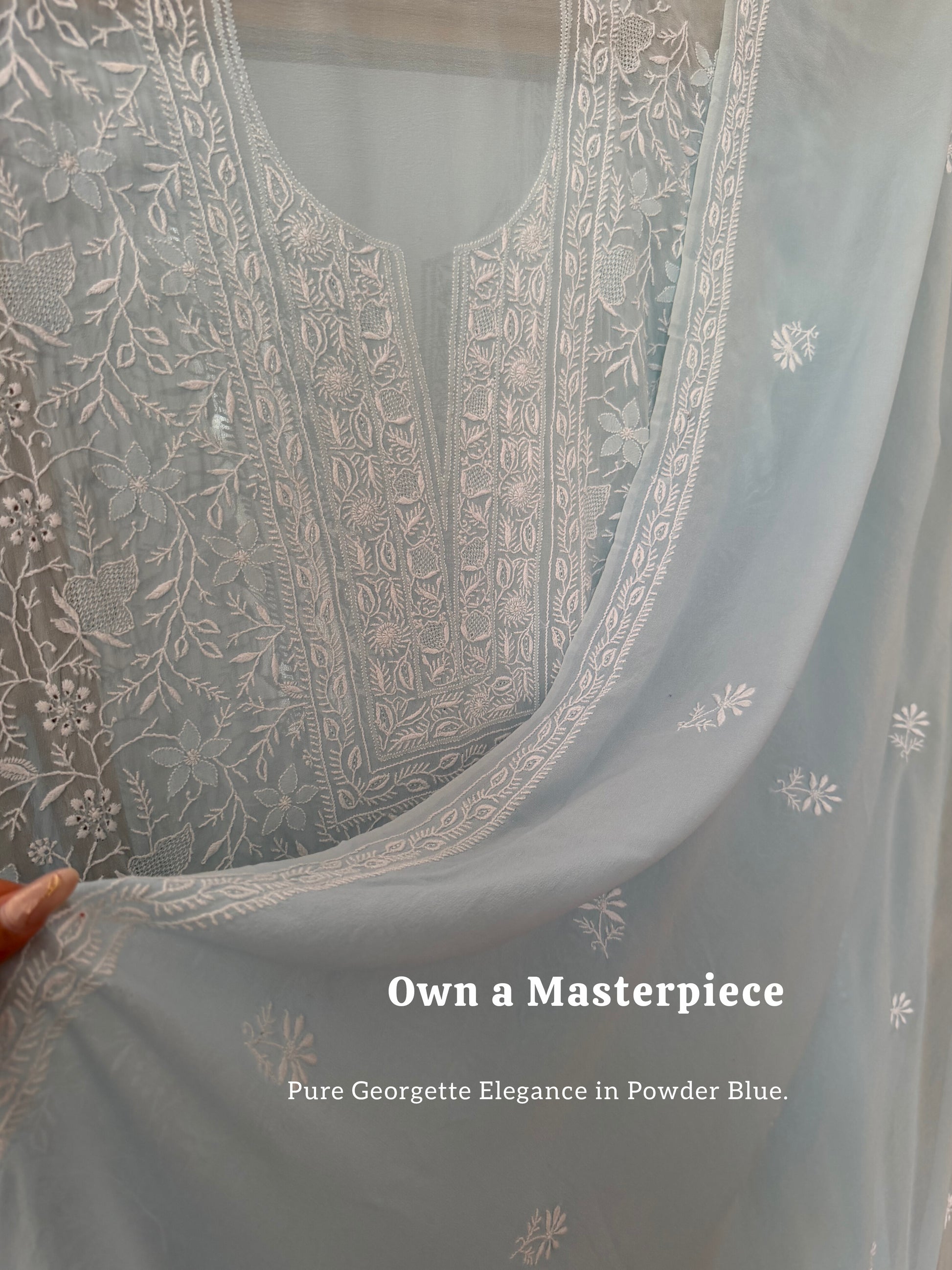 Powder blue pure georgette suit with do Taar chikankari displayed elegantly.