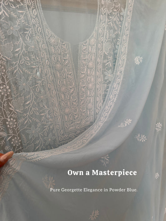 Powder blue pure georgette suit with do Taar chikankari displayed elegantly.