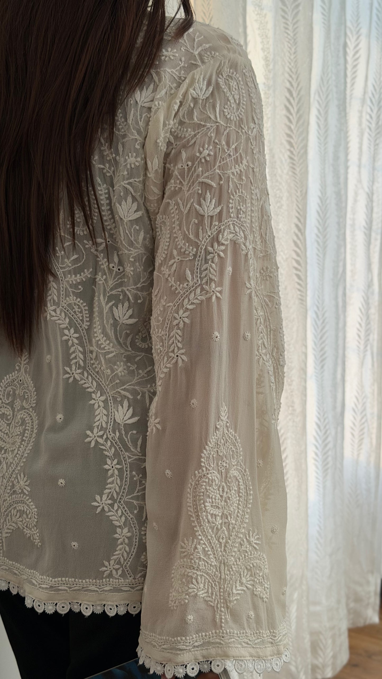 The Mehrab Shirt showcasing intricate hand-embroidered chikankari on pure georgette, highlighting its elegant design.