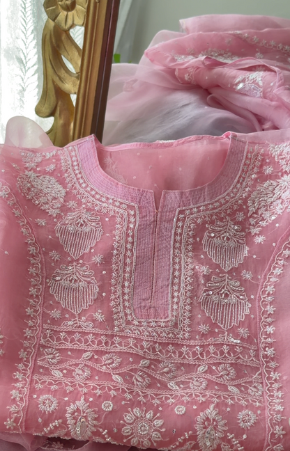 Pink Pure Organza Silk kurta set featuring intricate Chikankari embroidery and embellishments.